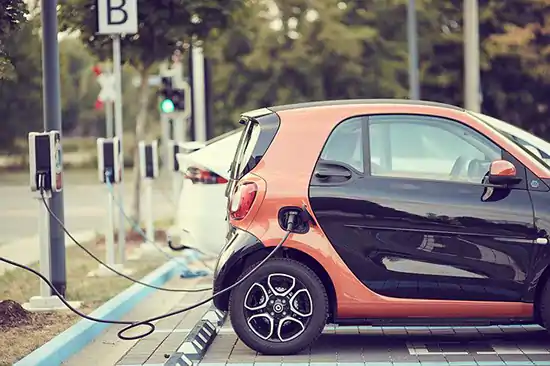 black and orange electric car charging