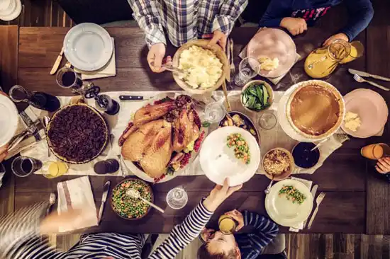 Top view of family eating at Thanksgiving table