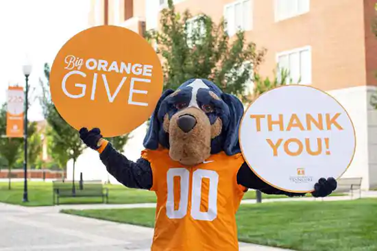 Tennessee Vols dog maskot in with cirle thank you and big orange give signs