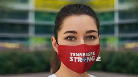 young woman with covid-19 face mask with tennessee strong logo
