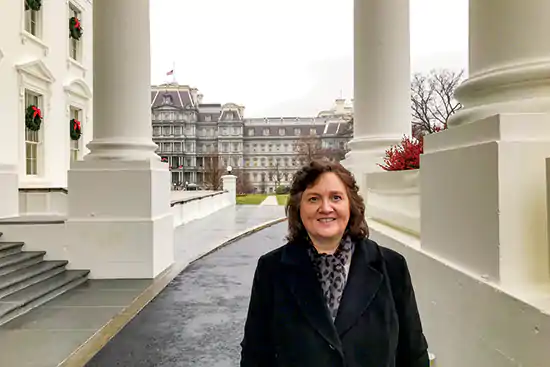 UT Professor Lynne Parker stands outside the West Wing of the White House