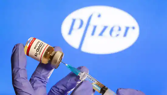 Syringe and Pfizer COVID-19 Vaccine