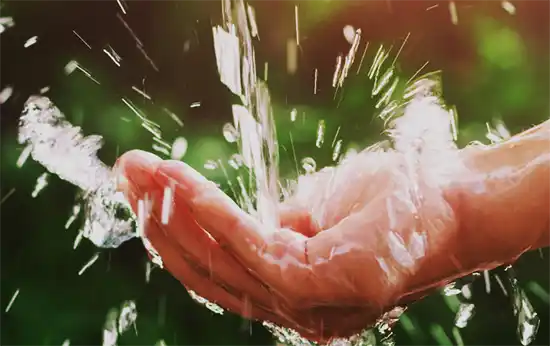 water pouring on hand
